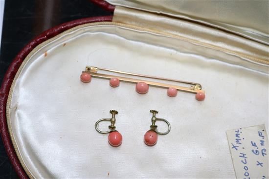 A group of assorted coral jewellery, including necklaces.